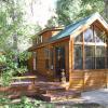 Creekside Cabin Park Model Cabin with Green Metal Roof and Side Patio Built on site