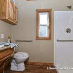 The Honeysuckle Model P-504 by Platinum Cottages and RRC Athens. This wheelchair friendly model features a roll-in shower w/ grab bars and a fold down seat. it also features wider doorways and other features making accessibility easier.