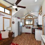 The Magnolia P-518 display model from Platinum Cottages on Display @ RRC Athens. Wrap-around porch, front kitchen park model RV.