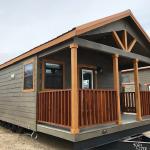 The Premier cabin by Platinum Cottages and Recreational Resort Cottages Athens. This value priced 15' wide park model is shown with cabin features including stained exterior hardi, and interior stained syp trim and accents.
