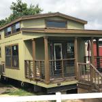 The Tumbleweed model P-576 by Platinum Cottages on display @ RRC Athens. This 15' wide park model features a shed style front porch roof, a huge loft and a king sized downstairs bedroom.